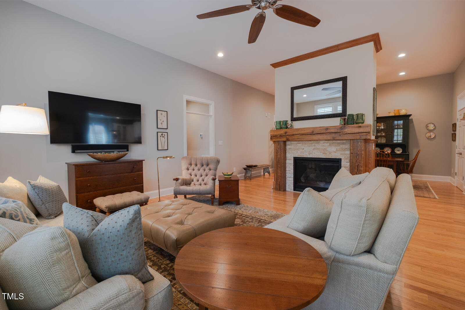 4331 Millcreek Circle Pittsboro, NC 27312 - Photo 25 of 56 a living room with furniture and a flat screen tv