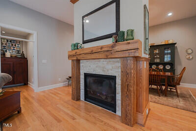 4331 Millcreek Circle Pittsboro, NC 27312 - Photo 26 of 56 a living room with furniture and a fireplace
