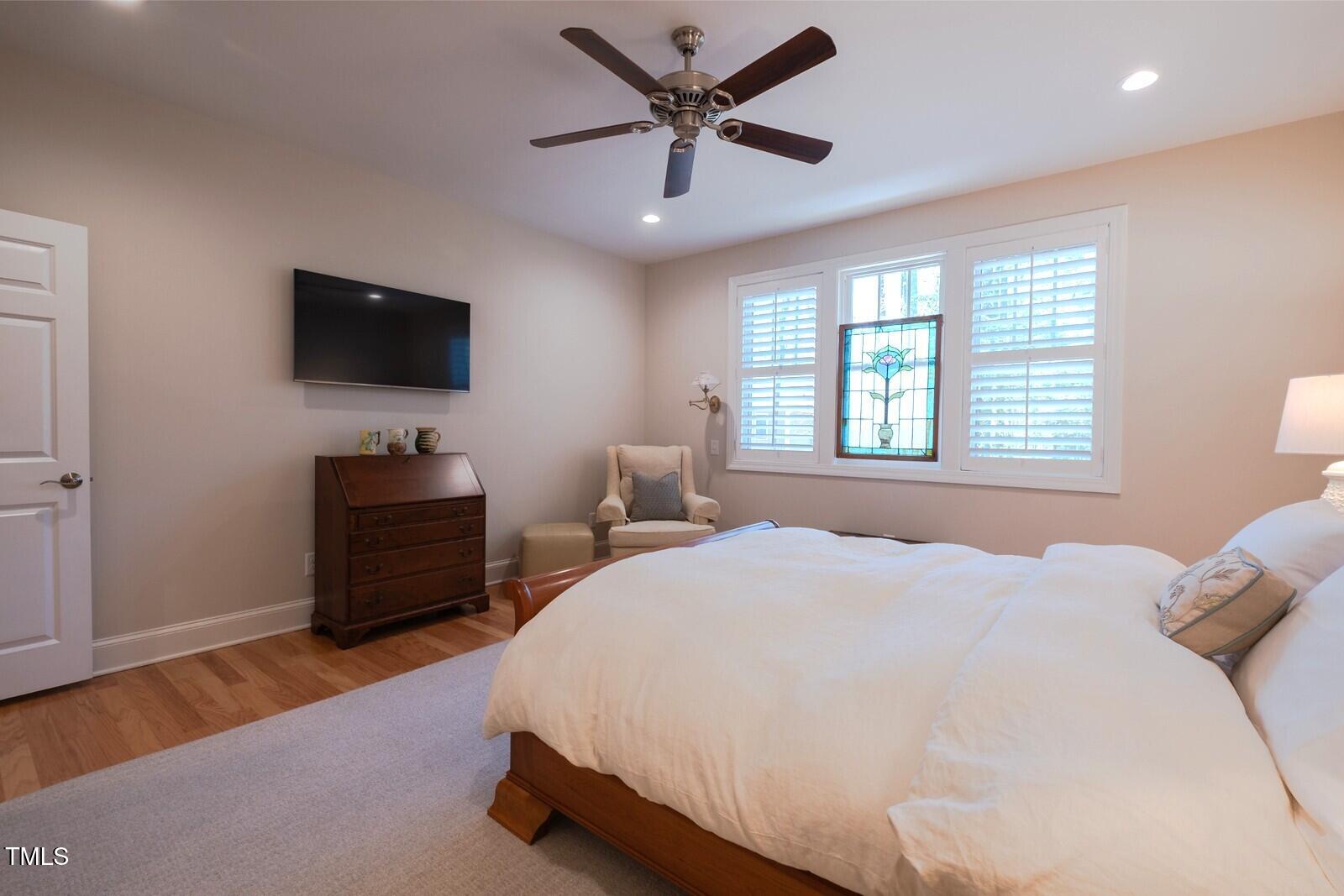 4331 Millcreek Circle Pittsboro, NC 27312 - Photo 31 of 56 a bedroom with a bed television and a window