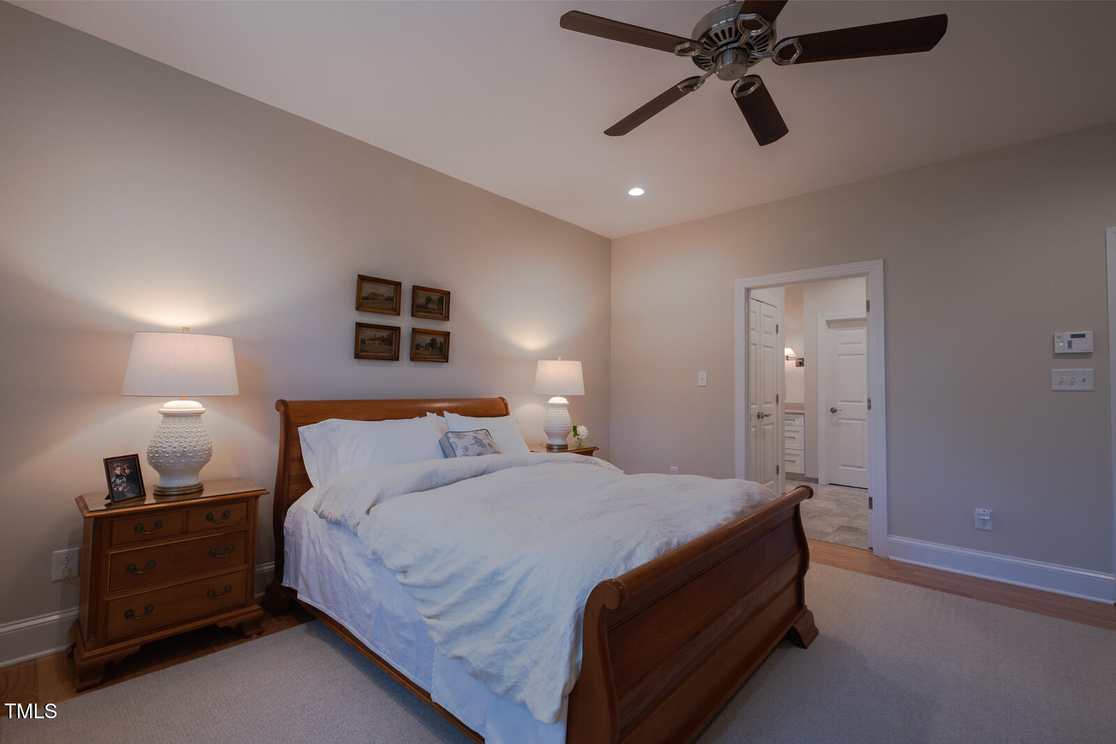 4331 Millcreek Circle Pittsboro, NC 27312 - Photo 32 of 56 a bedroom with a bed and a chandelier