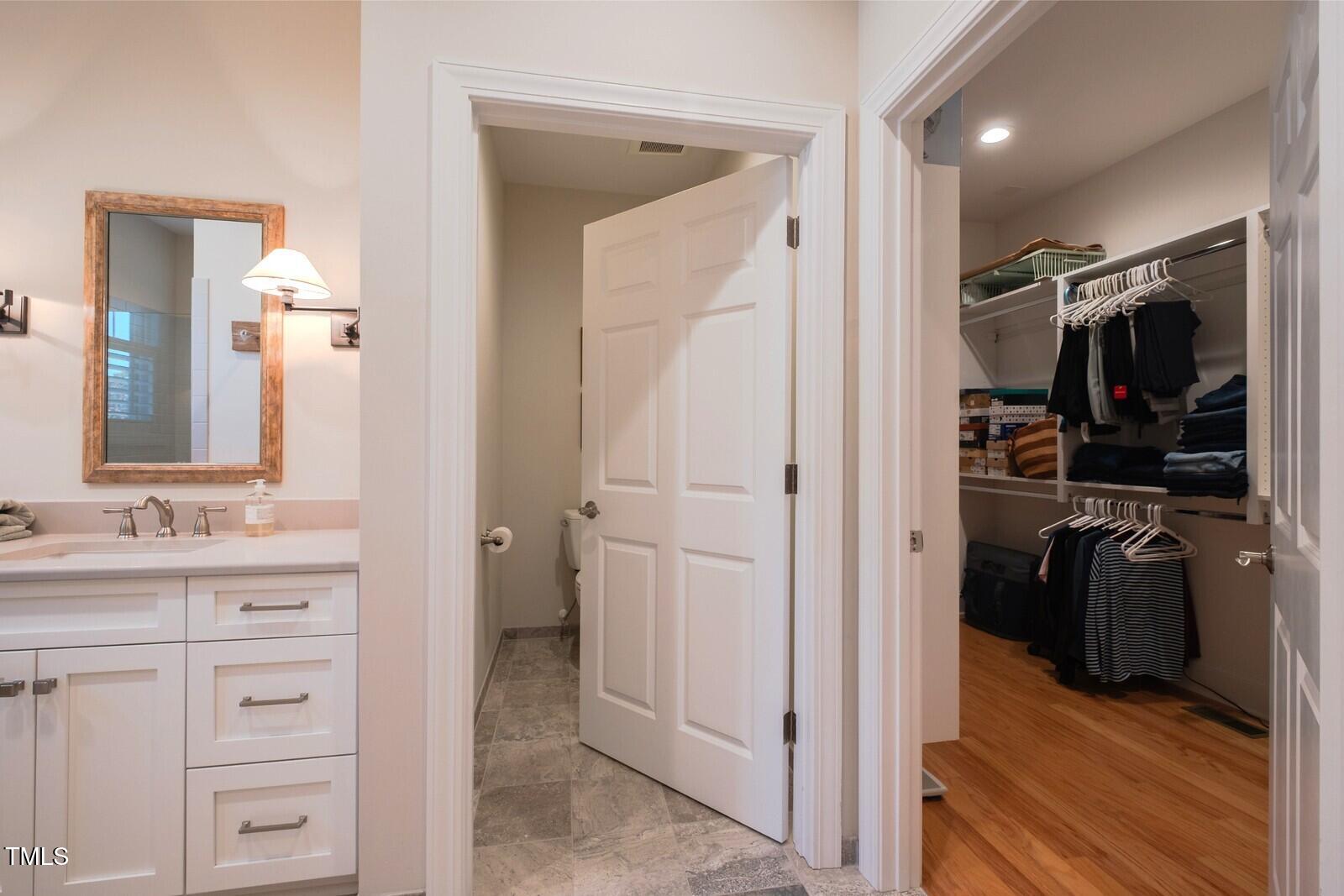 4331 Millcreek Circle Pittsboro, NC 27312 - Photo 33 of 56 a bathroom with a sink and a mirror