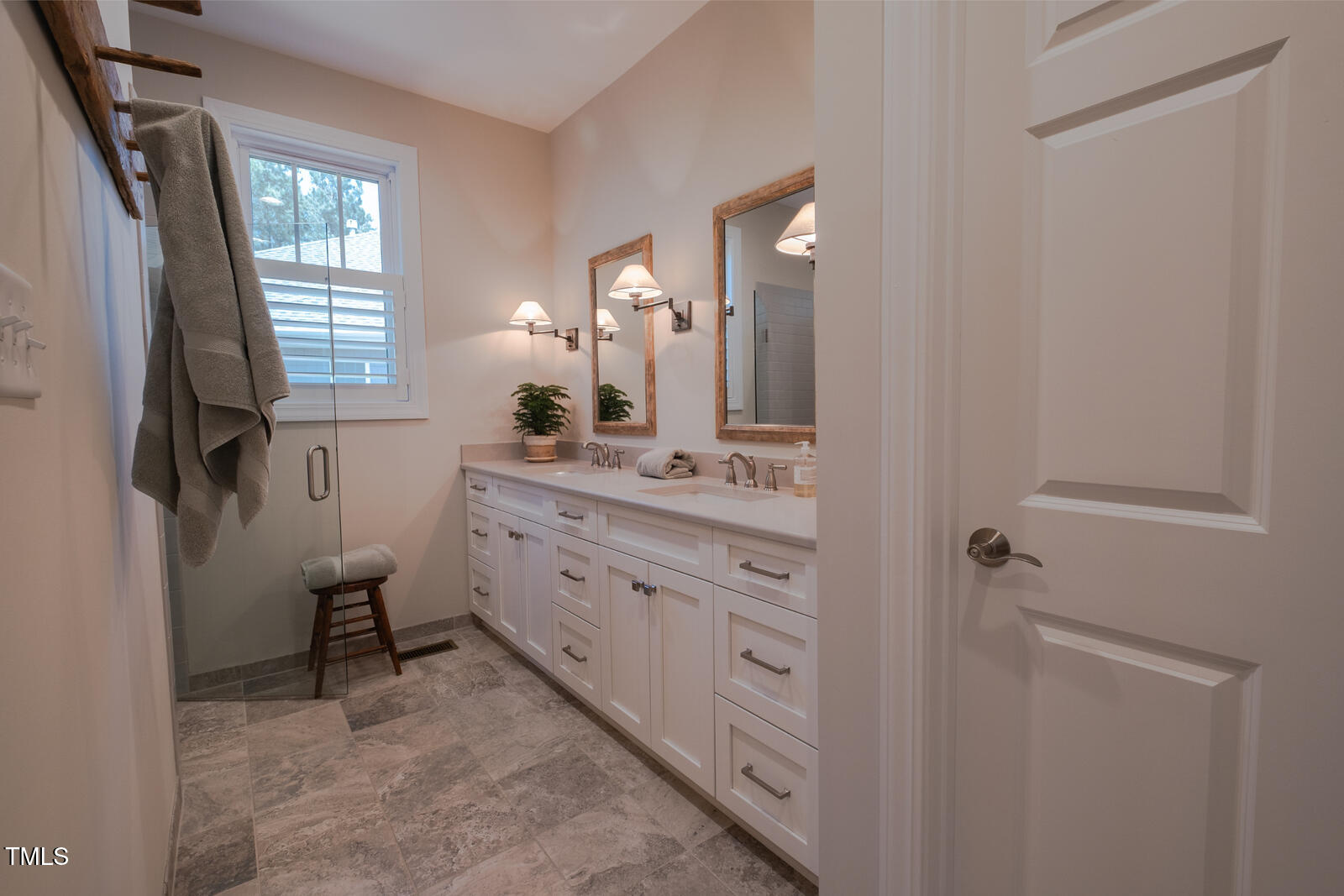 4331 Millcreek Circle Pittsboro, NC 27312 - Photo 34 of 56 a bathroom with a double vanity sink a toilet and a mirror