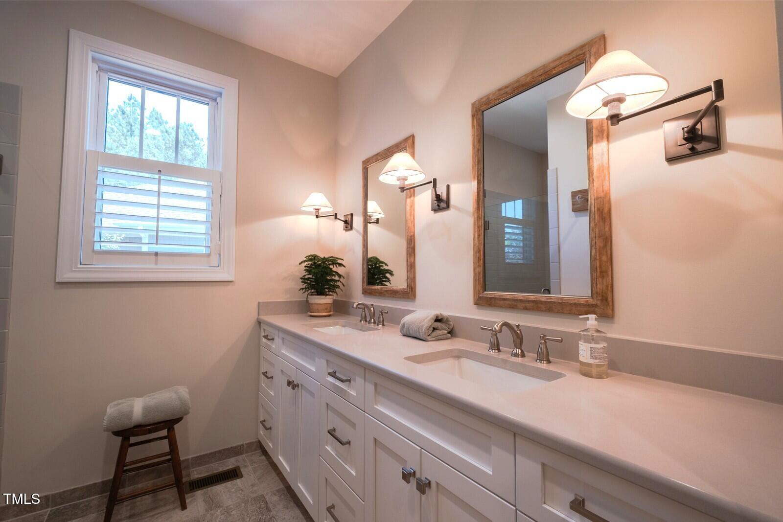 4331 Millcreek Circle Pittsboro, NC 27312 - Photo 35 of 56 a bathroom with a sink and a mirror