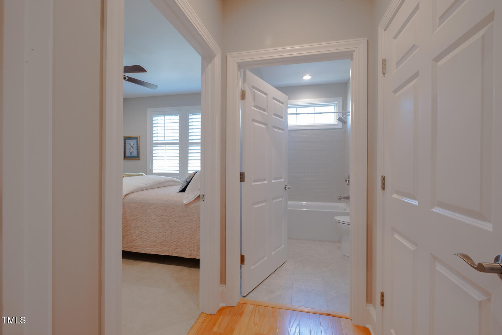 4331 Millcreek Circle Pittsboro, NC 27312 - Photo 38 of 56 a en suite bathroom with a tub shower and mirror