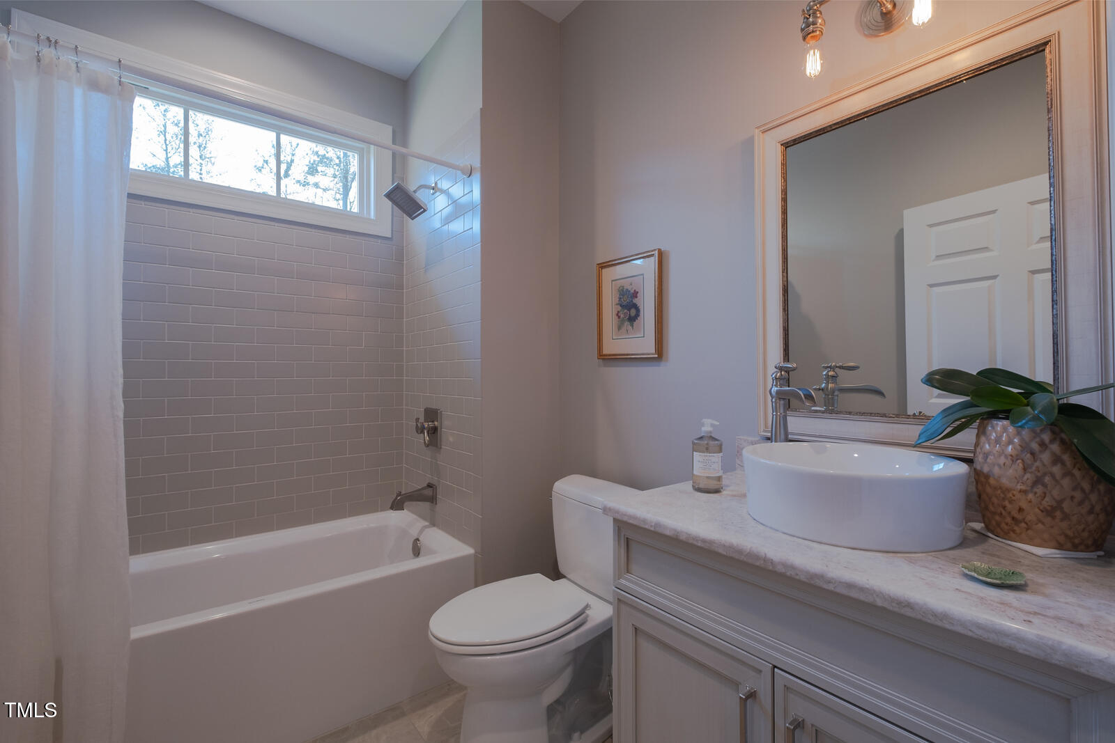 4331 Millcreek Circle Pittsboro, NC 27312 - Photo 39 of 56 a bathroom with a sink a toilet a tub and shower