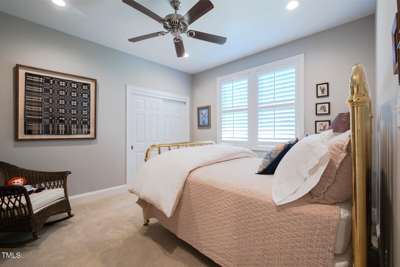 4331 Millcreek Circle Pittsboro, NC 27312 - Photo 41 of 56 a bed room with a bed and a chandelier