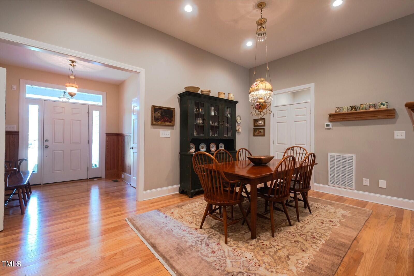4331 Millcreek Circle Pittsboro, NC 27312 - Photo 4 of 56 a view of a dining room with furniture and chandelier