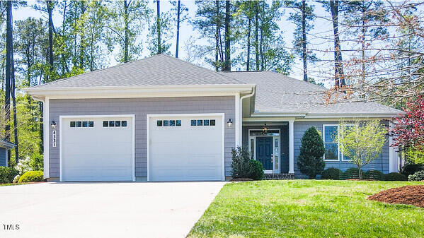 4331 Millcreek Circle Pittsboro, NC 27312 - Photo 51 of 56 a front view of a house with a yard