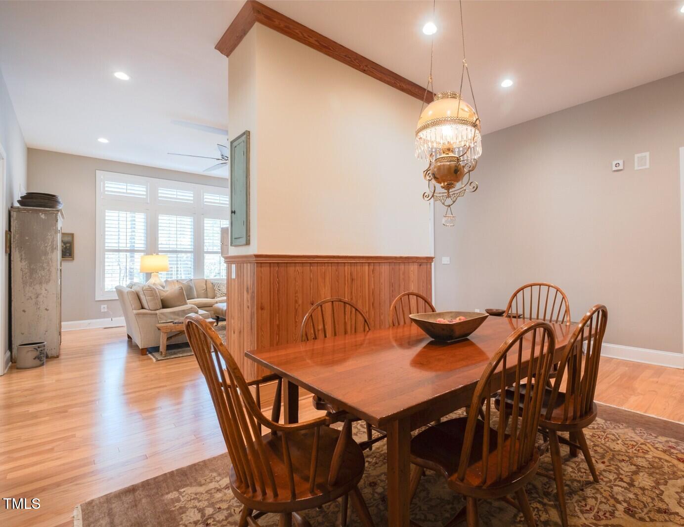 4331 Millcreek Circle Pittsboro, NC 27312 - Photo 6 of 56 a view of a dining room with furniture wooden floor and chandelier