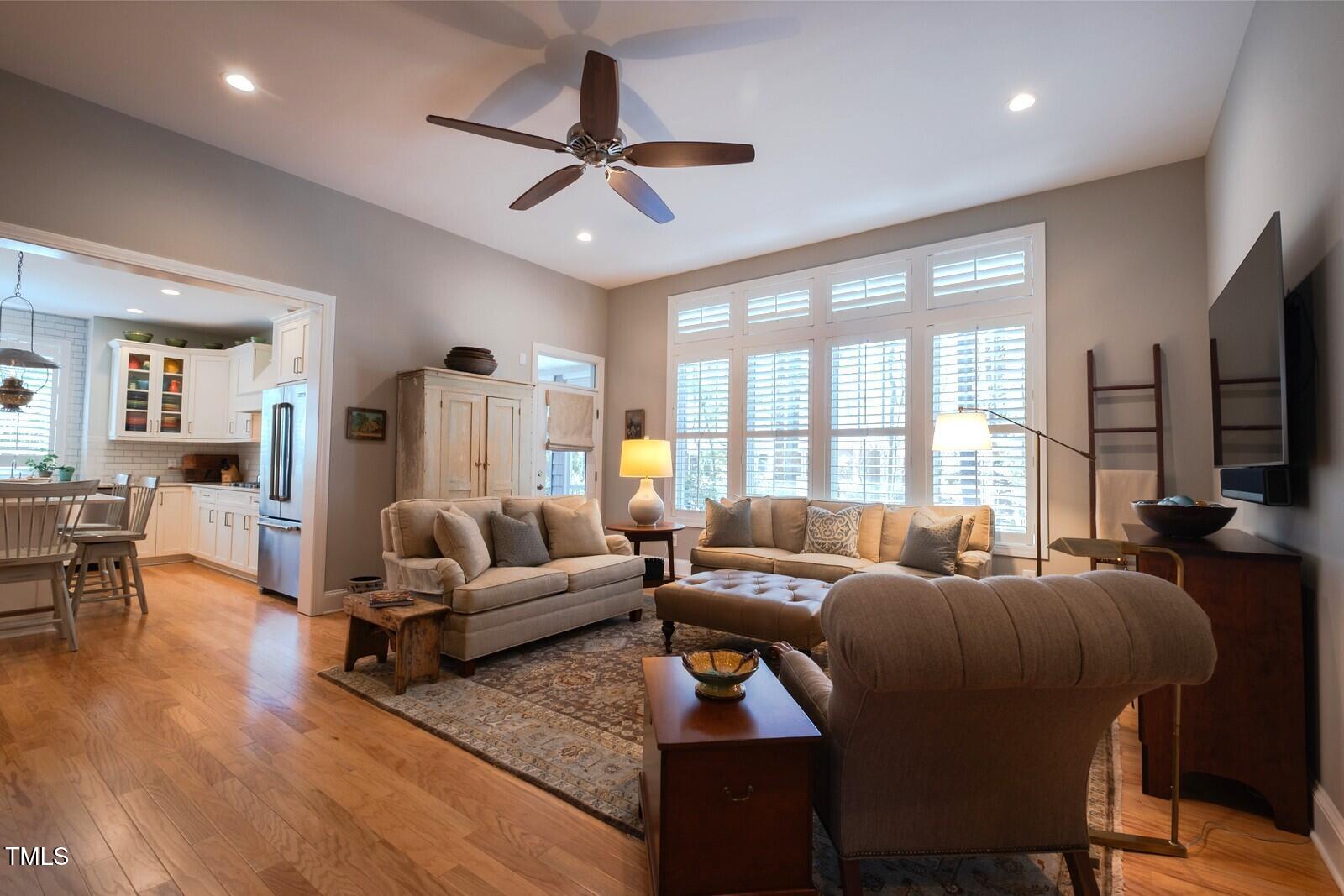 4331 Millcreek Circle Pittsboro, NC 27312 - Photo 7 of 56 a living room with furniture a ceiling fan and a large window