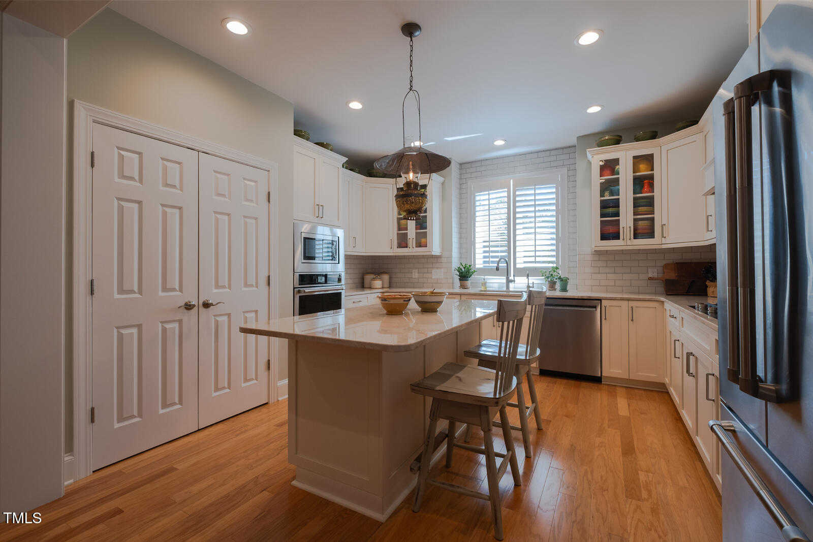 4331 Millcreek Circle Pittsboro, NC 27312 - Photo 8 of 56 a kitchen with stainless steel appliances granite countertop a refrigerator a sink dishwasher a stove and white countertops with wooden floor