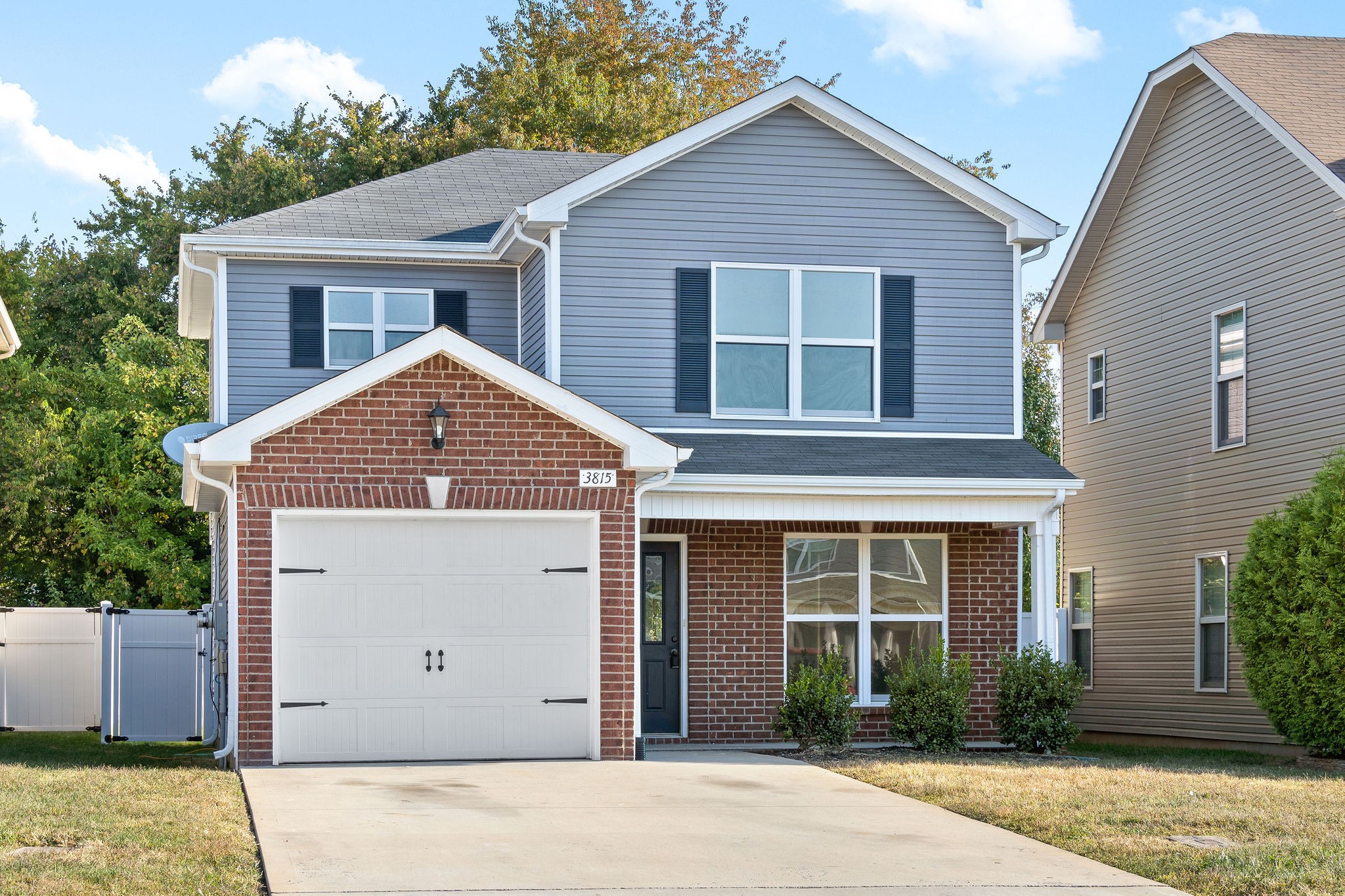 3815 Harvest Ridge Clarksville, TN 37040 - Photo 1 of 24 a front view of a house with a garden