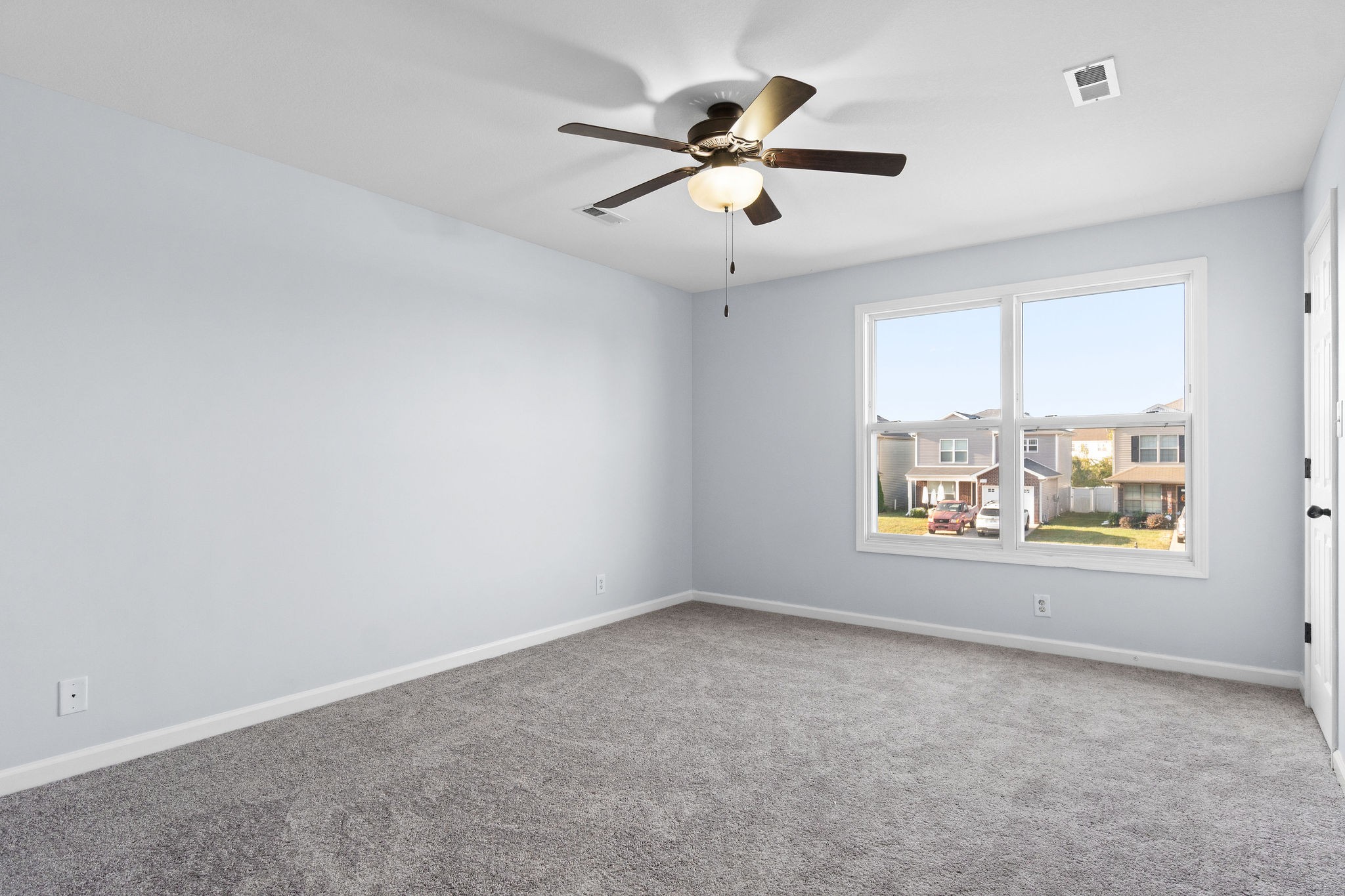 3815 Harvest Ridge Clarksville, TN 37040 - Photo 12 of 24 en empty room with windows and ceiling fan