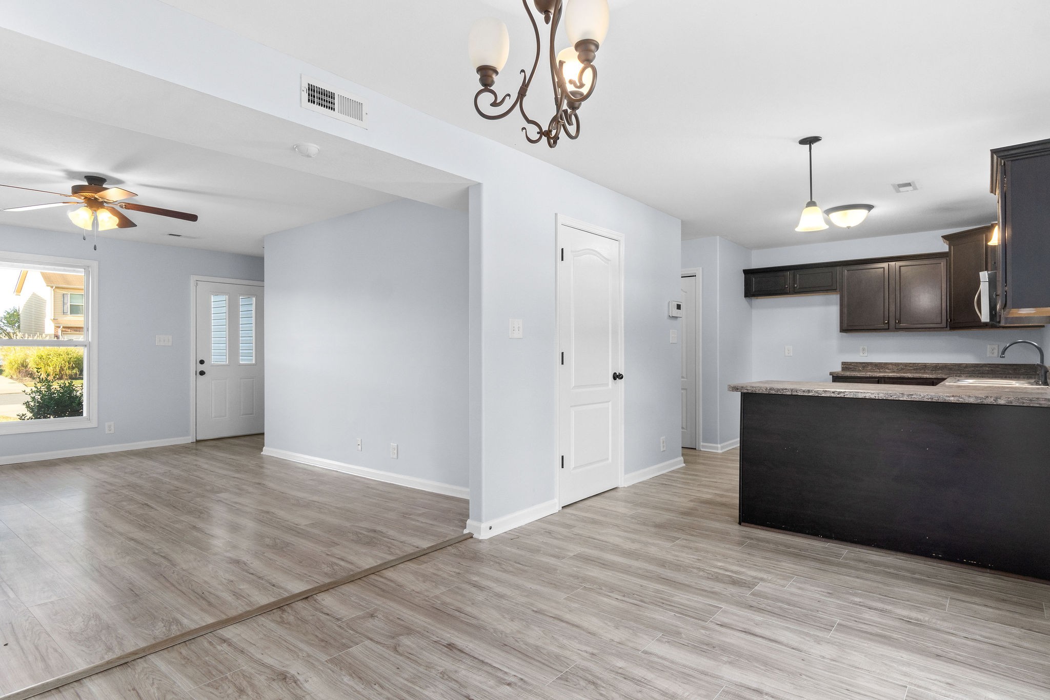 3815 Harvest Ridge Clarksville, TN 37040 - Photo 6 of 24 a view of kitchen and empty room with wooden floor