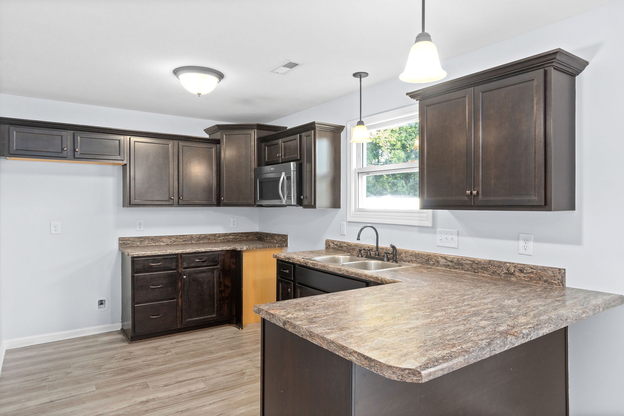 3815 Harvest Ridge Clarksville, TN 37040 - Photo 9 of 24 a kitchen with a sink stove and refrigerator