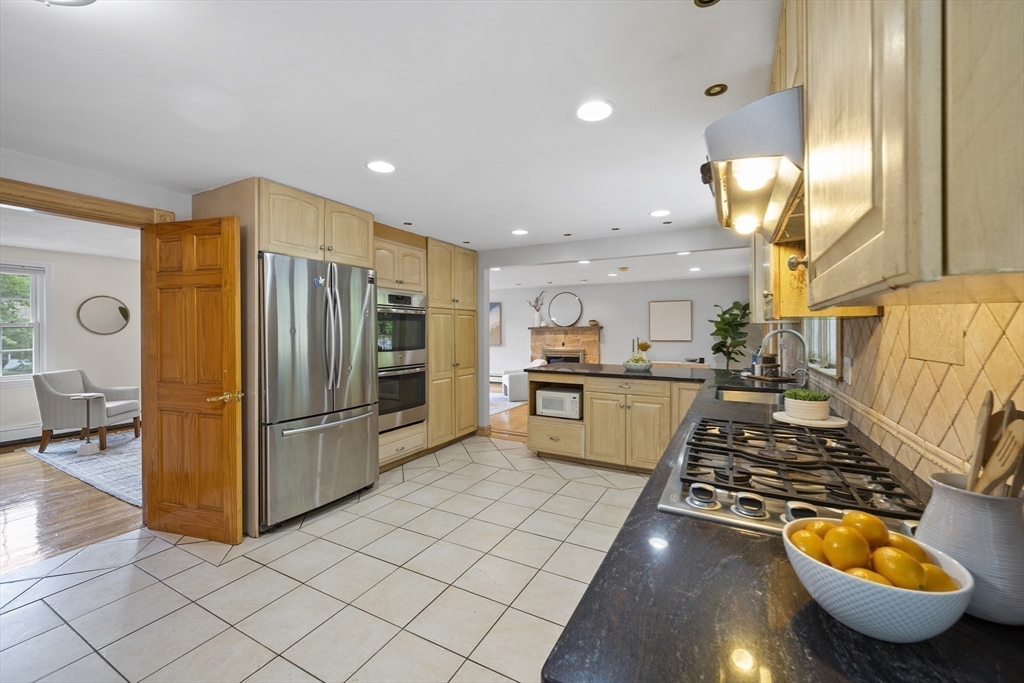 12 Colonial Lane Canton, MA 02021 - Photo 18 of 42 a kitchen with stainless steel appliances granite countertop a refrigerator and a sink