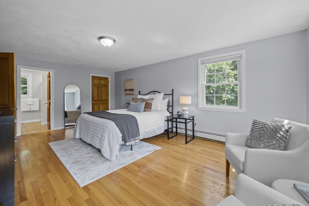 12 Colonial Lane Canton, MA 02021 - Photo 21 of 42 a bedroom with a bed and a couch