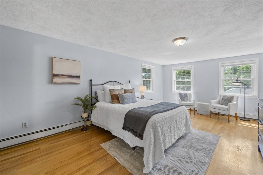 12 Colonial Lane Canton, MA 02021 - Photo 22 of 42 a bedroom with bed couch and window