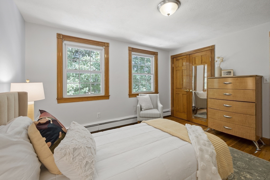 12 Colonial Lane Canton, MA 02021 - Photo 27 of 42 a bedroom with a bed and a window