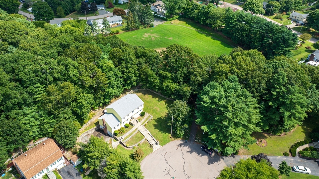 12 Colonial Lane Canton, MA 02021 - Photo 3 of 42 an aerial view of a house with yard swimming pool and outdoor seating