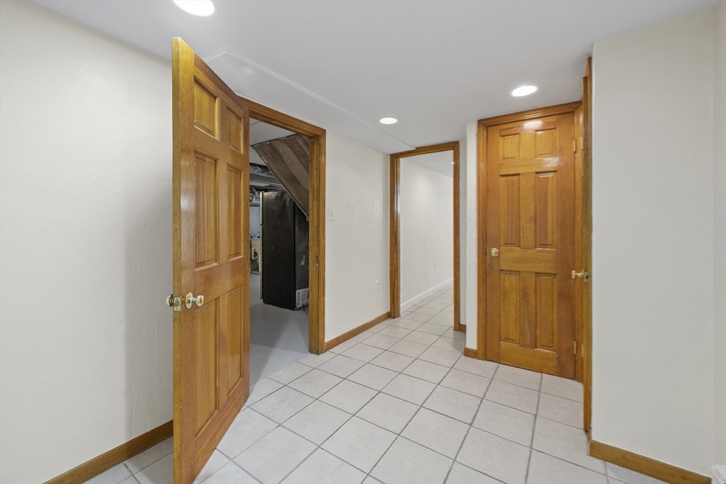 12 Colonial Lane Canton, MA 02021 - Photo 33 of 42 a view of a hallway with closet and bathroom