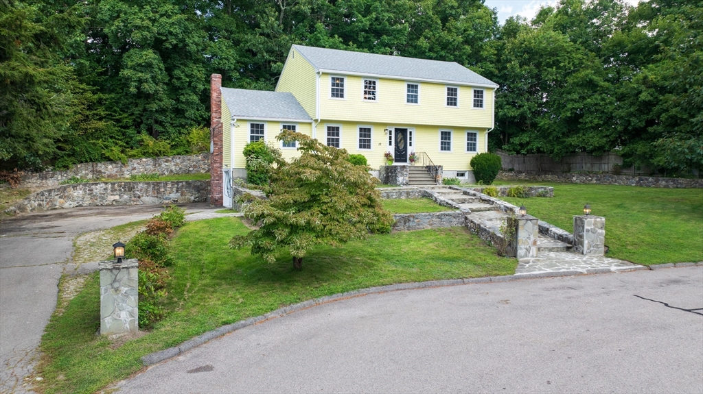 12 Colonial Lane Canton, MA 02021 - Photo 38 of 42 a front view of a house with garden