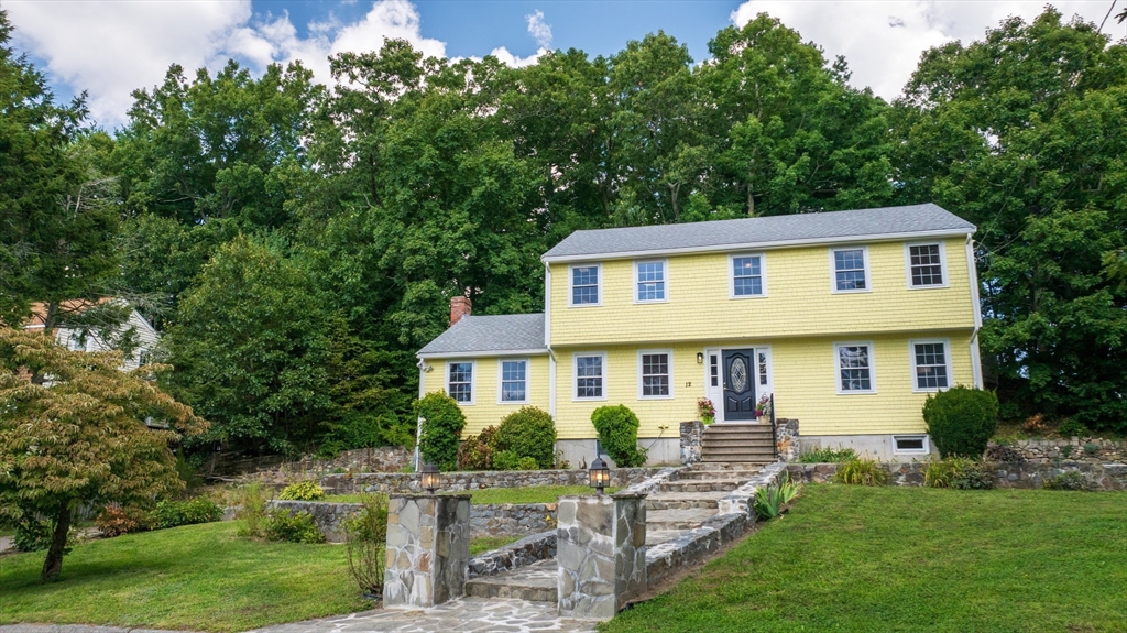 12 Colonial Lane Canton, MA 02021 - Photo 40 of 42 a front view of a house with a yard