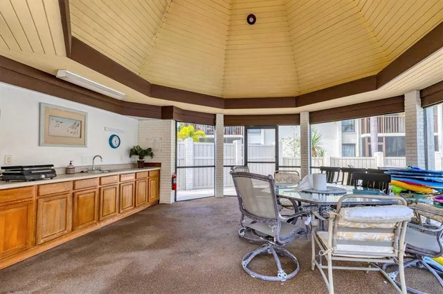 an aerial view of house with yard swimming pool and outdoor seating