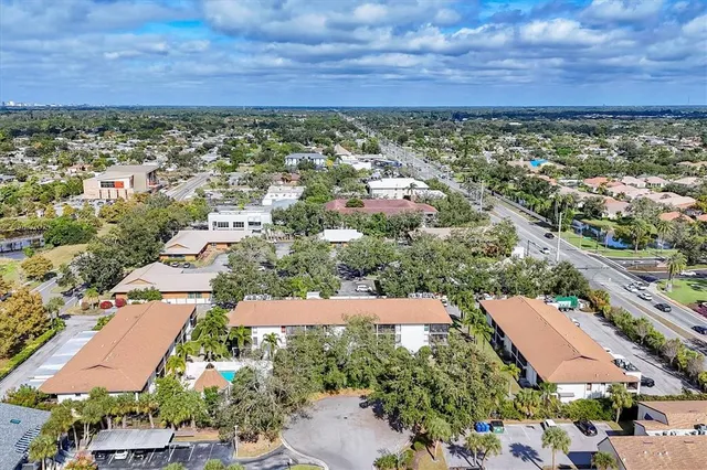 an aerial view of residential building and parking space