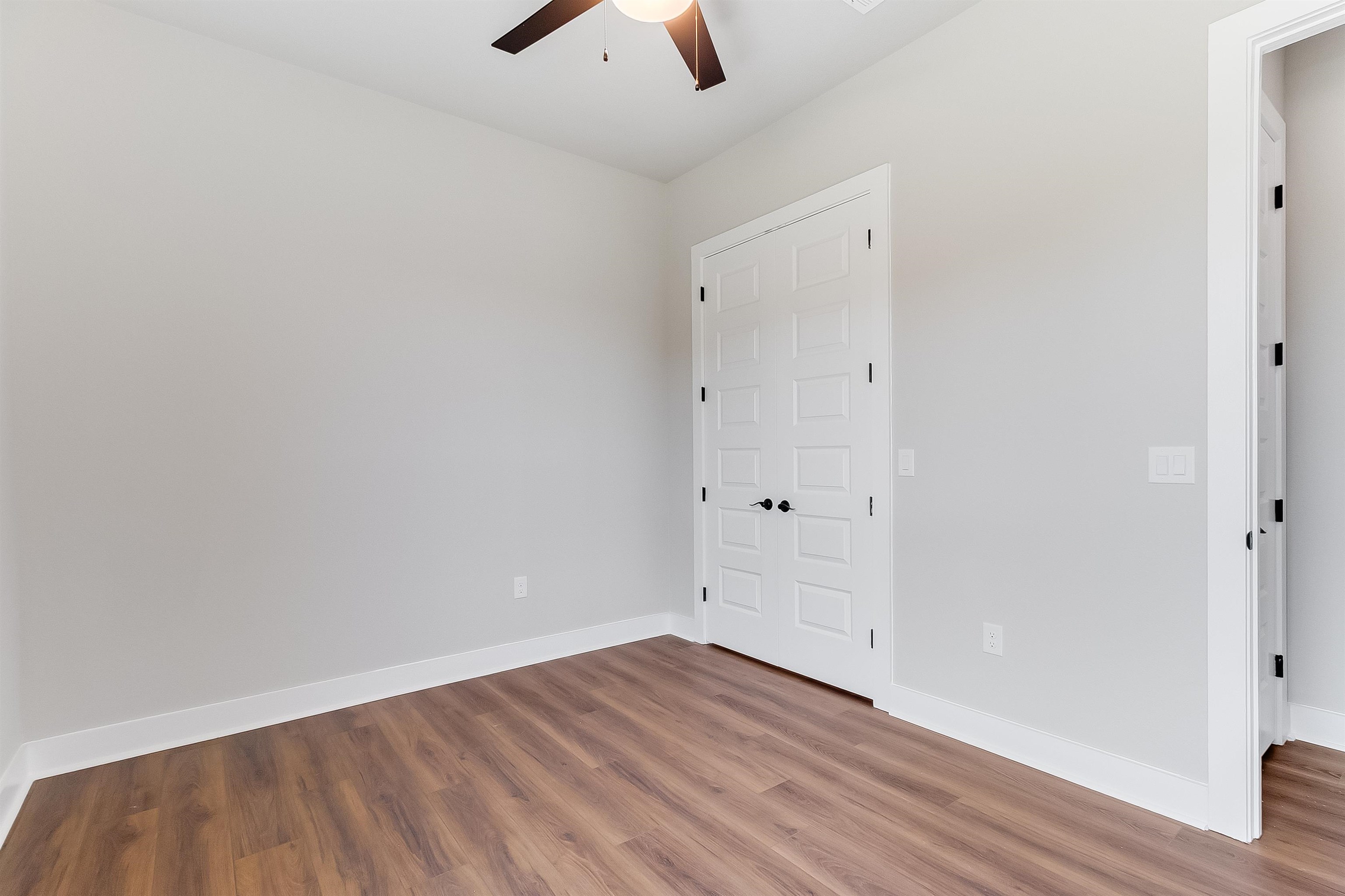 118 Rosebud Rnch Road Bertram, TX 78605 - Photo 15 of 23 a view of an empty room with wooden floor