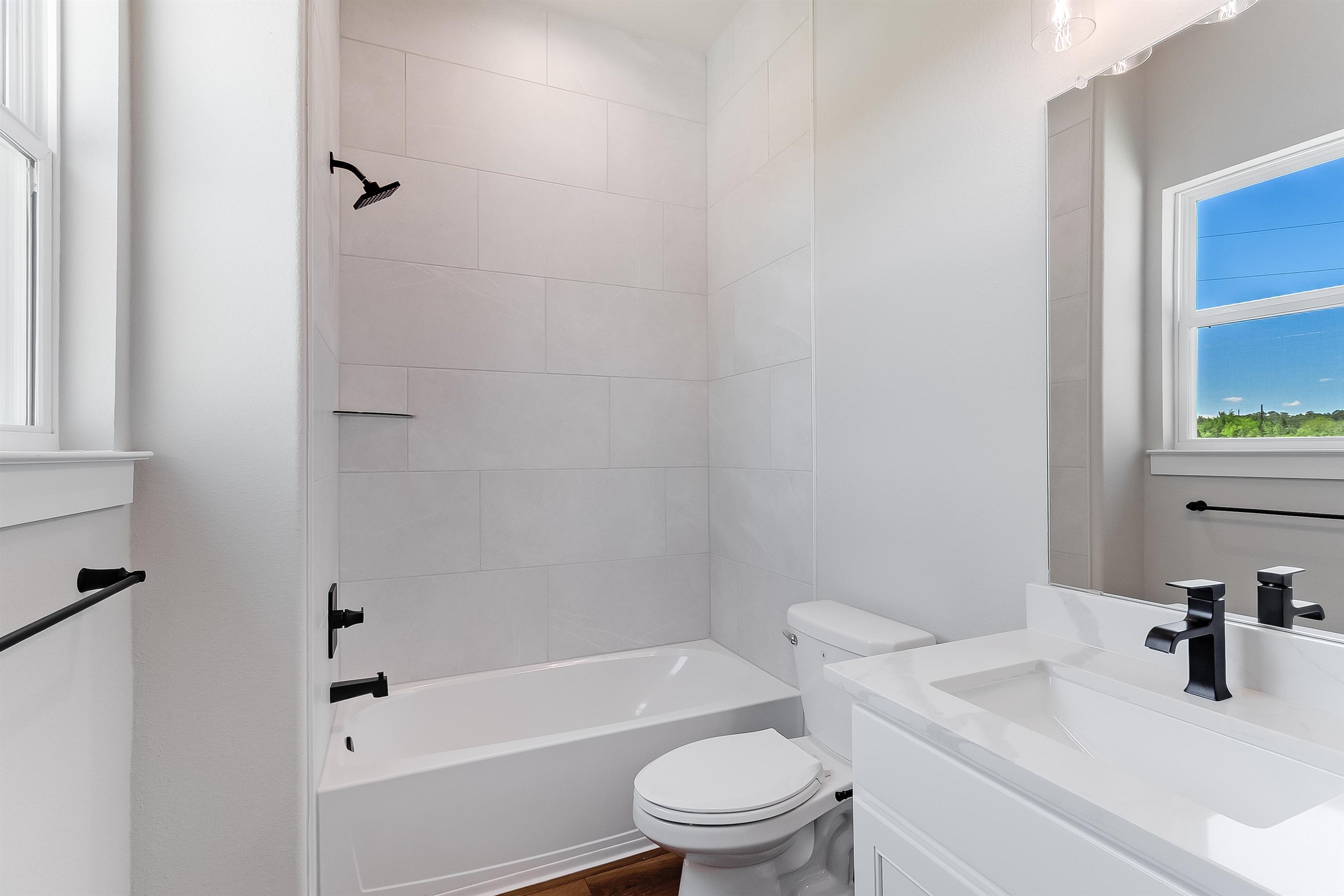 118 Rosebud Rnch Road Bertram, TX 78605 - Photo 17 of 23 a bathroom with a sink toilet and shower