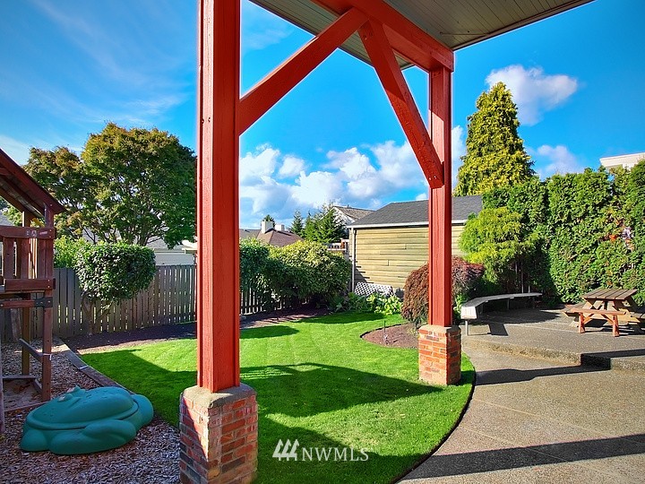 3015 West Viewmont Way West Seattle, WA 98199 - Photo 12 of 15 a backyard of a house with a garden and outdoor seating