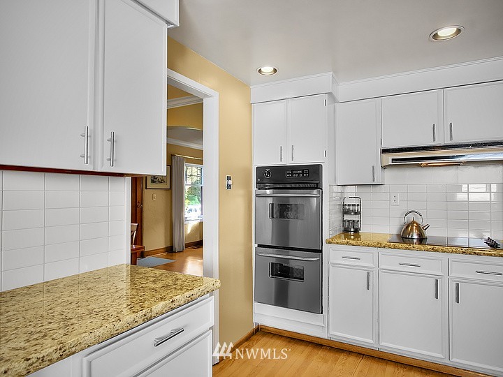 3015 West Viewmont Way West Seattle, WA 98199 - Photo 5 of 15 a kitchen with refrigerator and cabinets