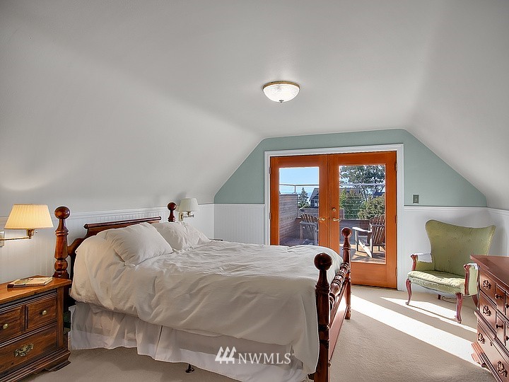 3015 West Viewmont Way West Seattle, WA 98199 - Photo 8 of 15 a bedroom with a bed and a large window