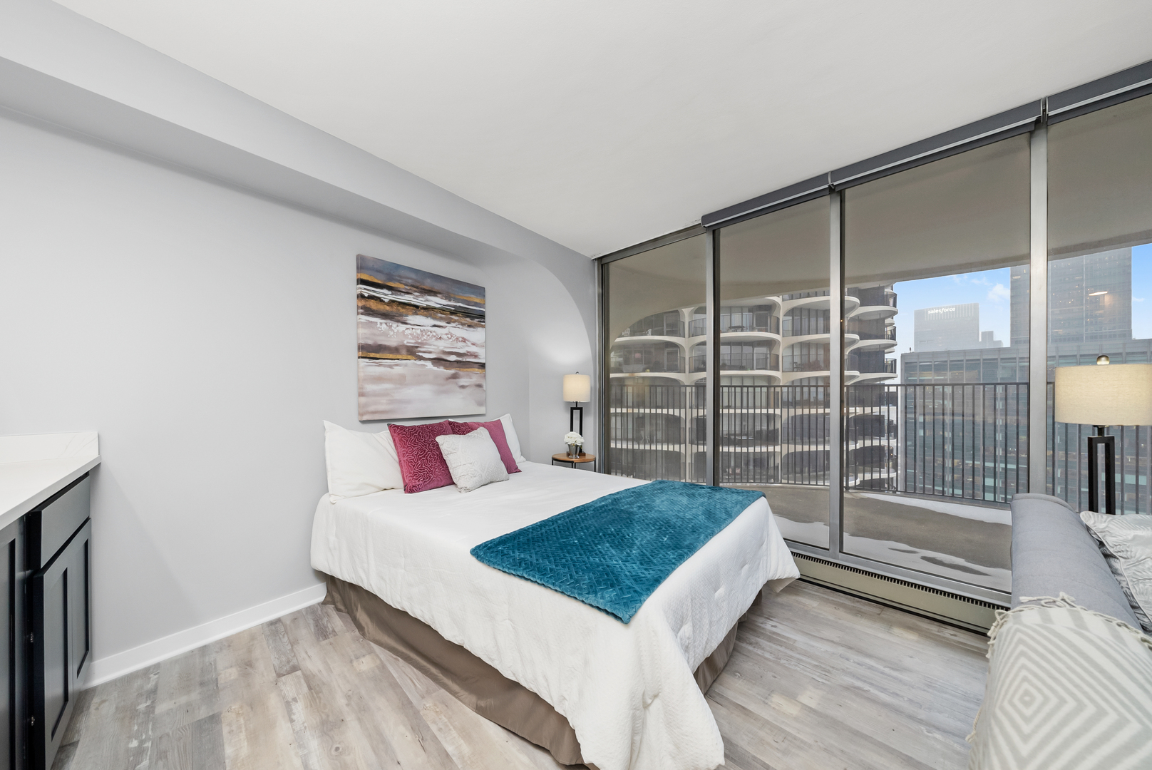 300 North State Street, Unit 5225 Chicago, IL 60654 - Photo 12 of 17 a bedroom with a bed and a window