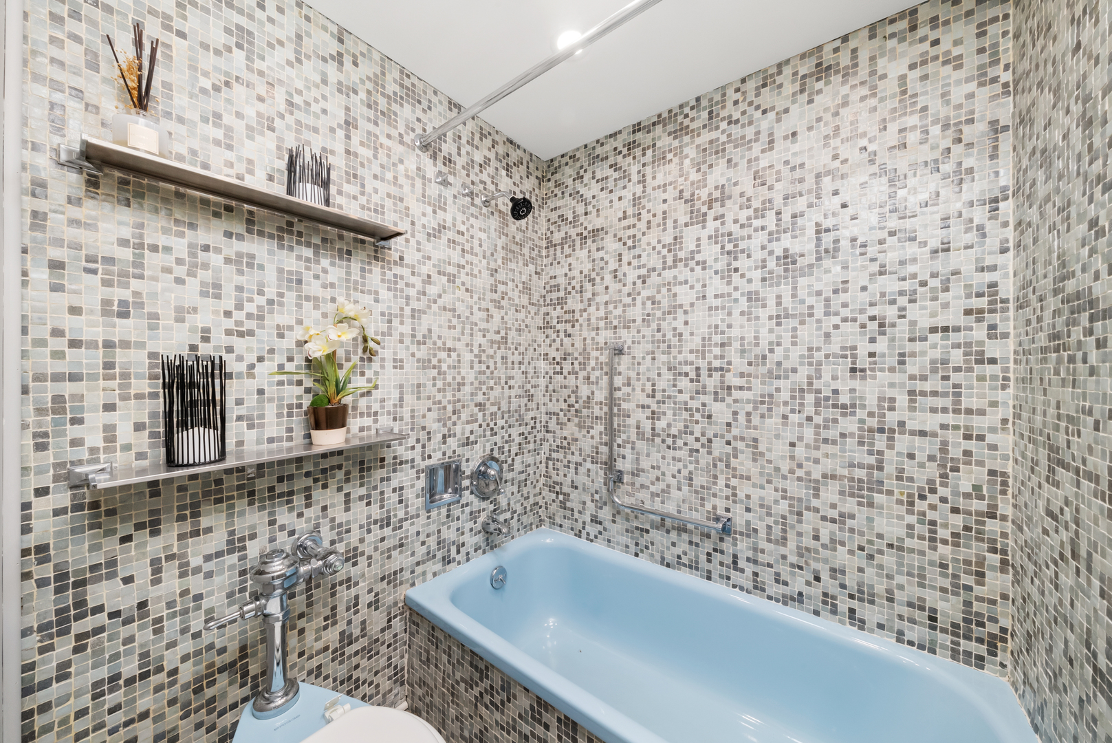 300 North State Street, Unit 5225 Chicago, IL 60654 - Photo 14 of 17 a bathroom with a shower and a sink