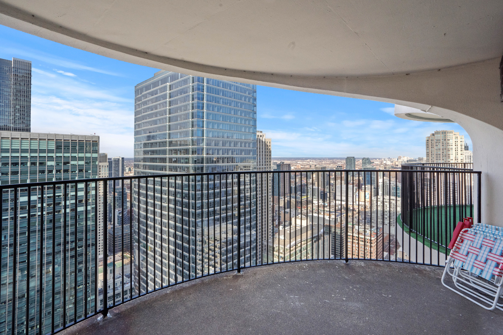 300 North State Street, Unit 5225 Chicago, IL 60654 - Photo 3 of 17 a view of a balcony with a floor to ceiling window