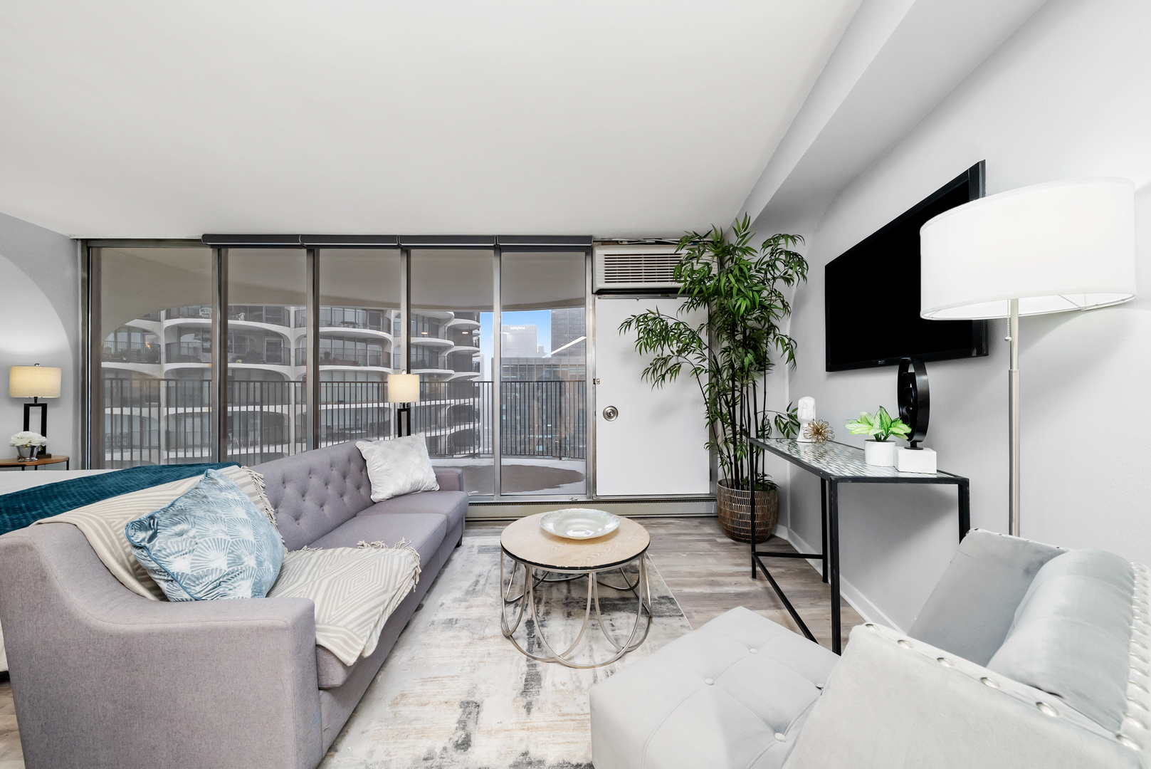 300 North State Street, Unit 5225 Chicago, IL 60654 - Photo 8 of 17 a living room with furniture and a large window