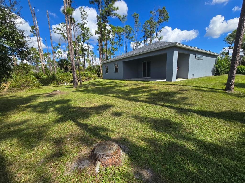 2143 Nabble Lane North Port, FL 34288 - Photo 17 of 17 a view of a house with a backyard