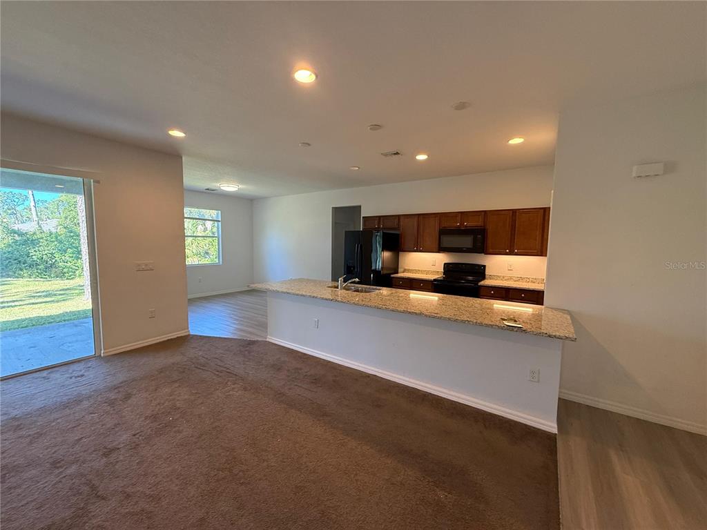 2143 Nabble Lane North Port, FL 34288 - Photo 4 of 17 a view of kitchen and center island with large window