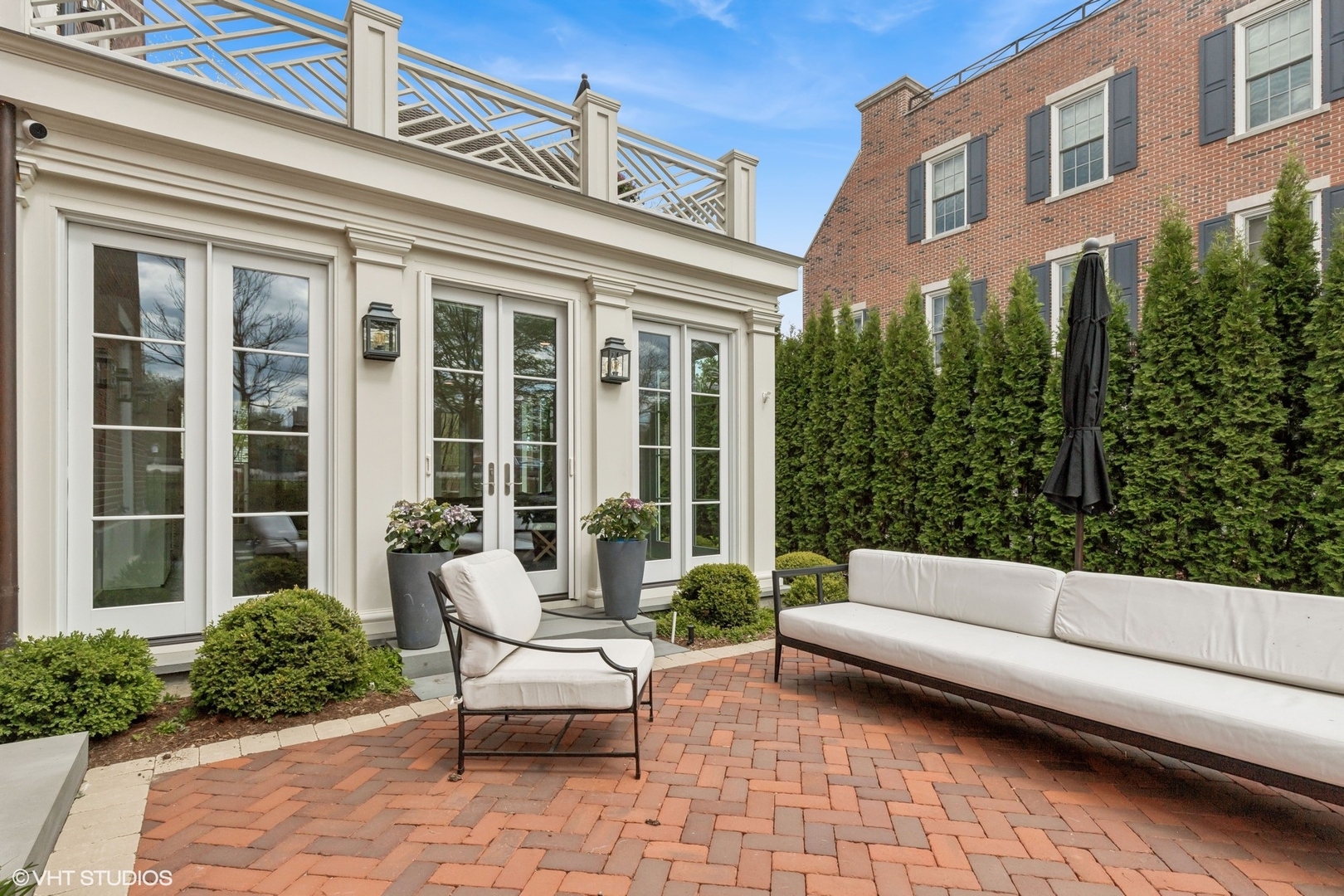 847 North McKinley Road Lake Forest, IL 60045 - Photo 39 of 46 a building outdoor space with patio furniture and potted plants