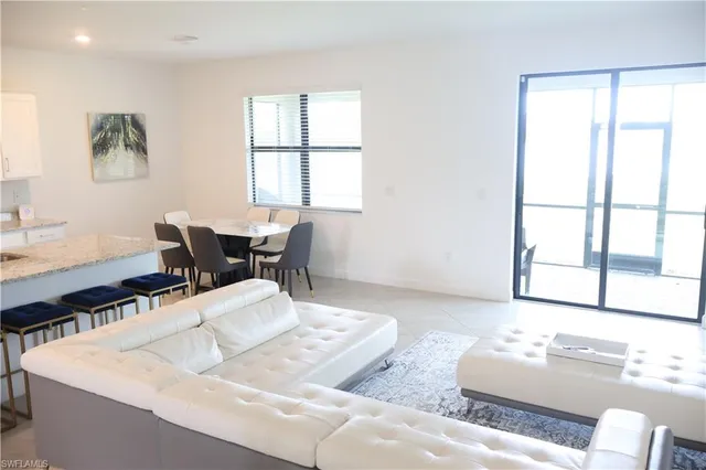 a living room with furniture and window