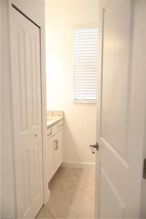 a bathroom with a sink a vanity and a mirror