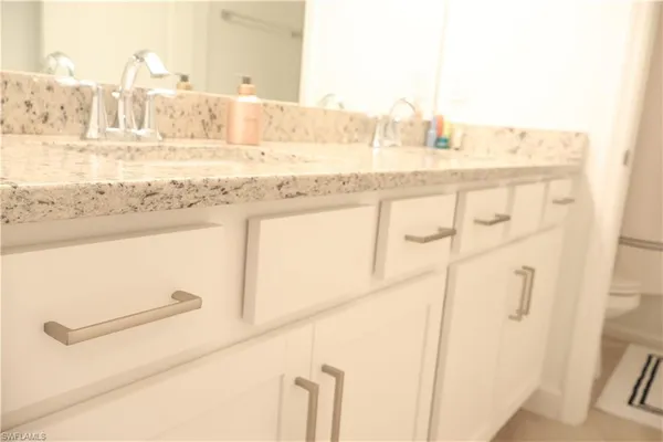 a view of walk in closet and window