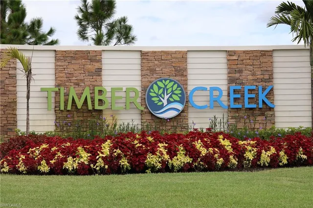 a sign that is sitting in front of a house