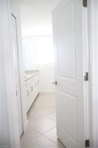 a bathroom with a tub sink and vanity