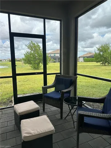a living room with large windows