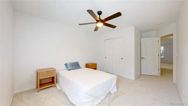 a bedroom with a bed and cabinets