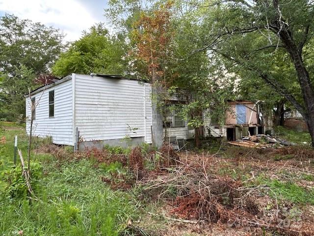 513 Boss Moore Road Ellenboro, NC 28040 - Photo 8 of 9 a view of a house with a yard