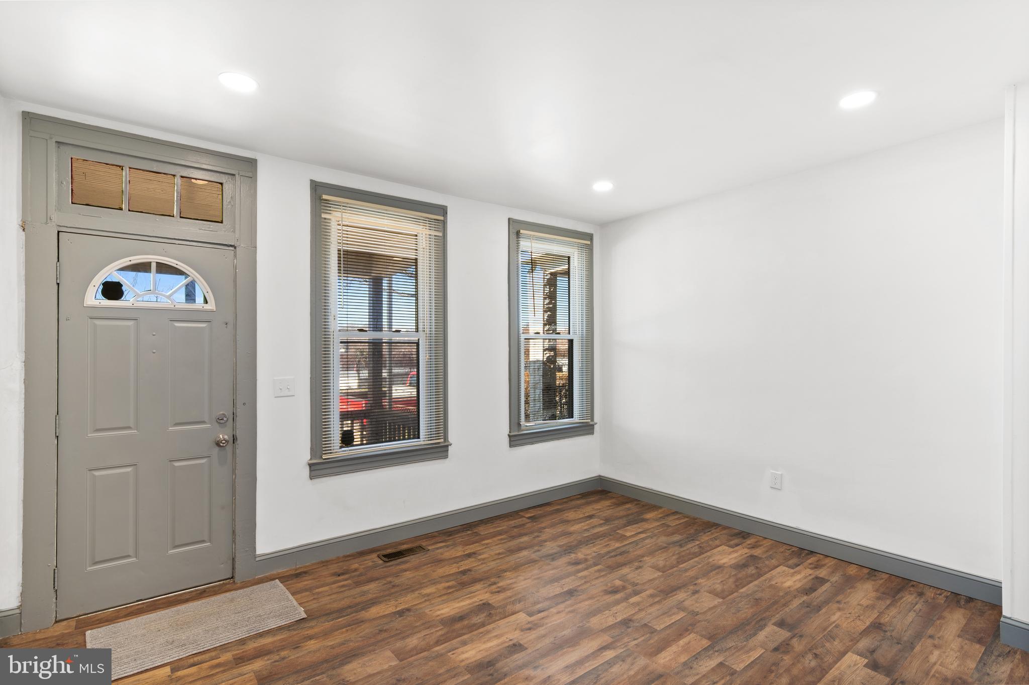 941 Brunswick Street Baltimore, MD 21223 - Photo 1 of 35 wooden floor in an empty room with a window